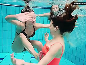three bare femmes have fun underwater