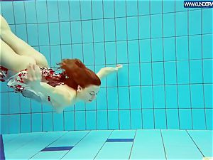 hot grind redhead swimming in the pool